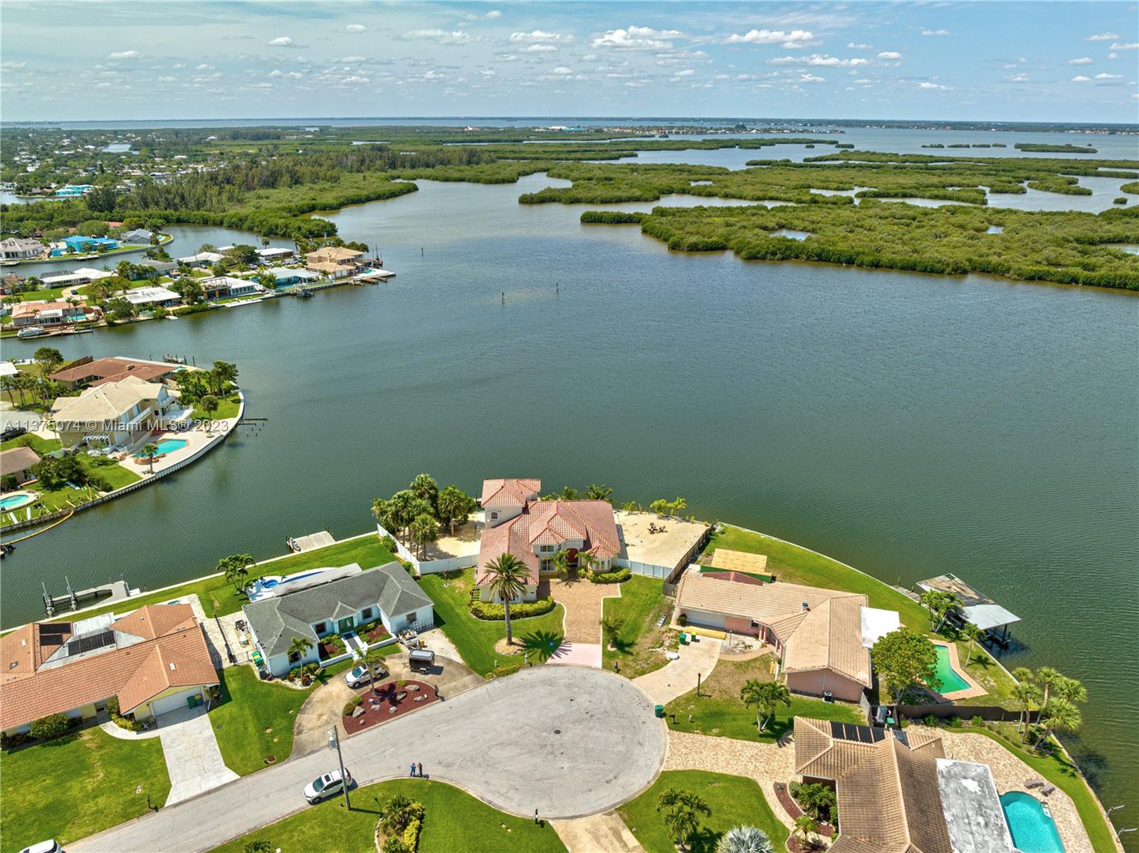 258 Bimini Road Cocoa Beach, FL 32931 - Photo 35 of 43 a view of a swimming pool with an ocean view