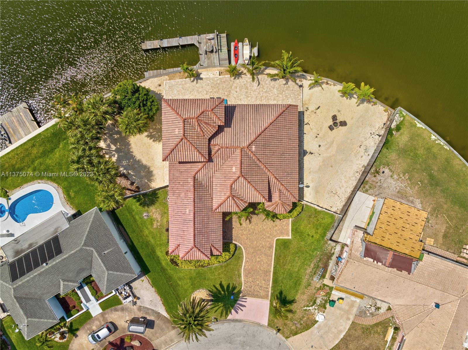 258 Bimini Road Cocoa Beach, FL 32931 - Photo 37 of 43 an aerial view of a house with a swimming pool and outdoor seating
