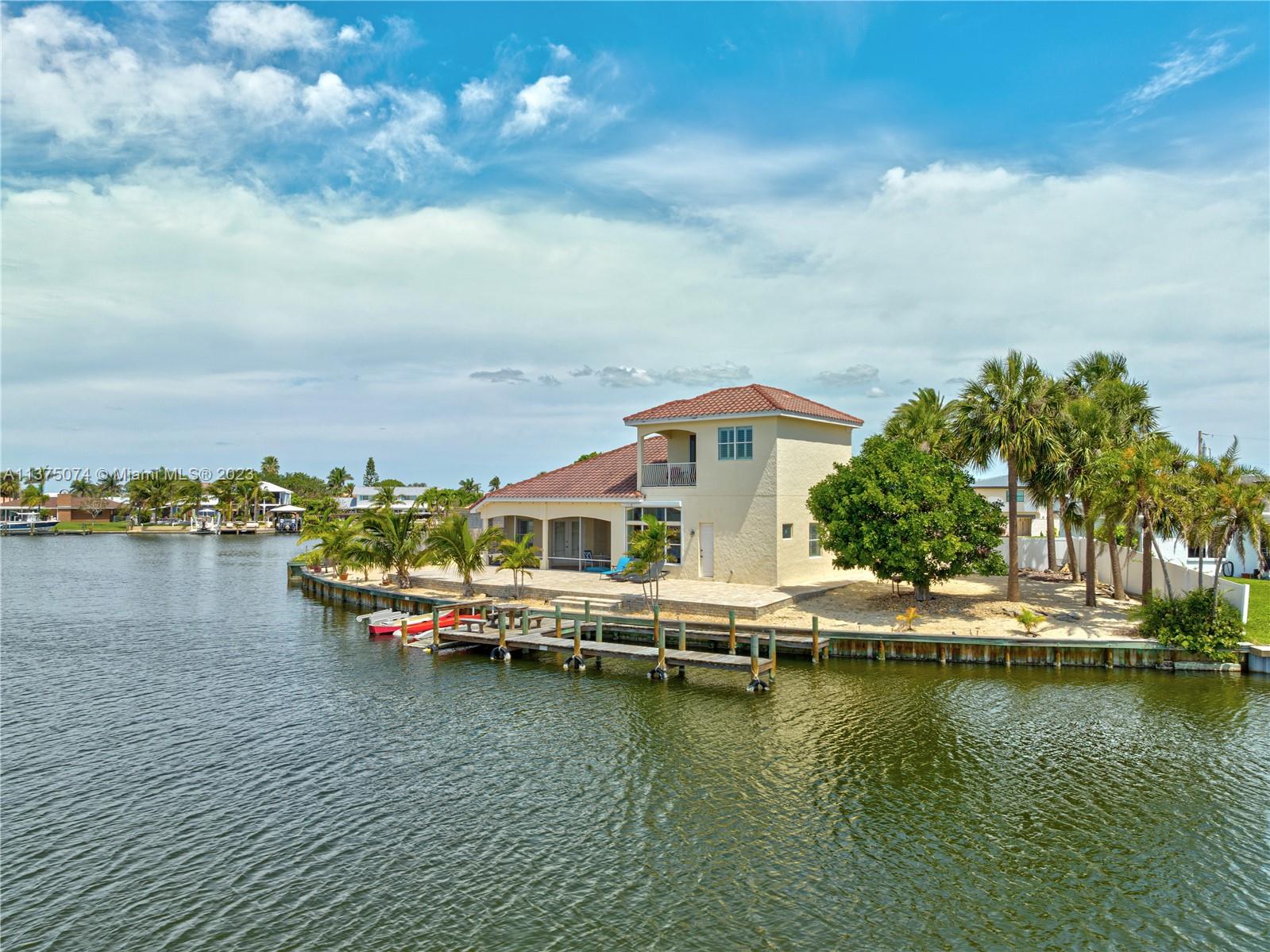 258 Bimini Road Cocoa Beach, FL 32931 - Photo 43 of 43 a view of a lake with houses
