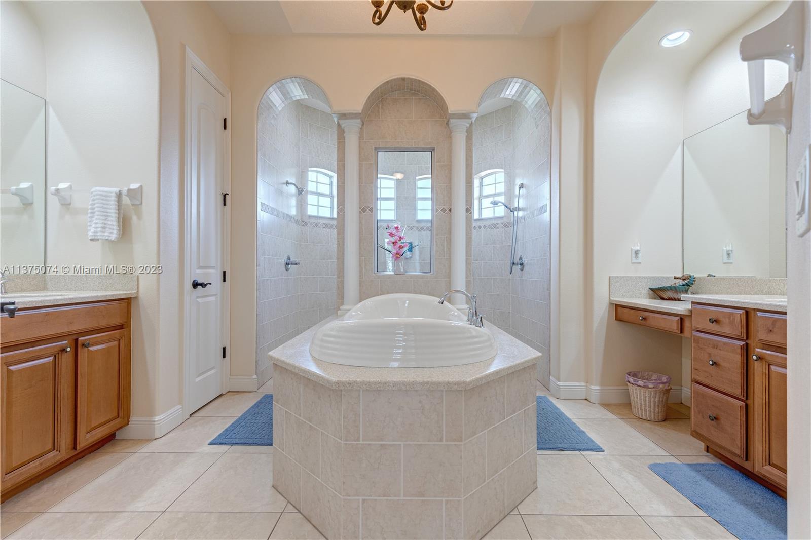 258 Bimini Road Cocoa Beach, FL 32931 - Photo 8 of 43 a large bathroom with a tub sink and mirror