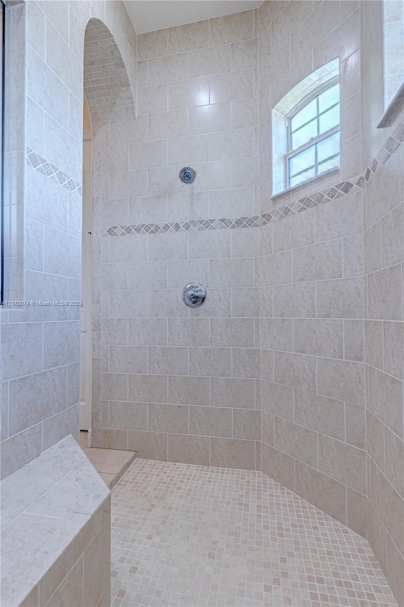 258 Bimini Road Cocoa Beach, FL 32931 - Photo 9 of 43 a bathroom with a granite countertop sink a window and shower
