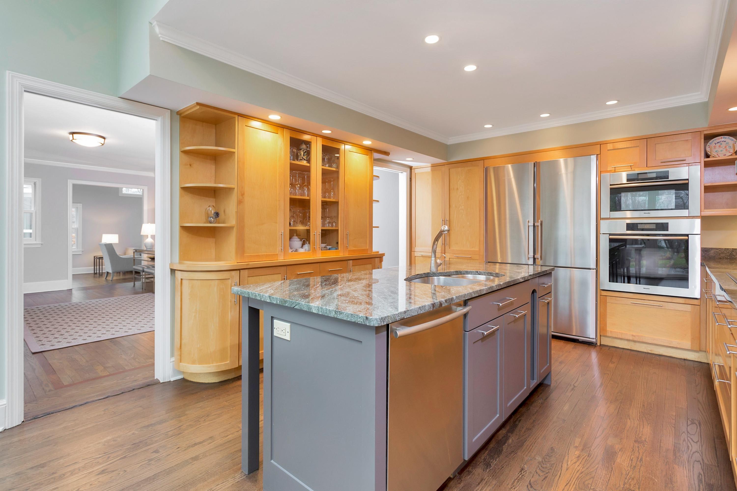 7 Point O Woods Road Darien, CT 06820 - Photo 8 of 27 a kitchen with stainless steel appliances granite countertop a stove and a sink