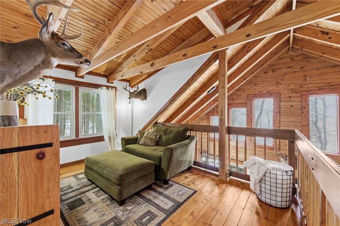 5352 Lance Road Medina, OH 44256 - Photo 23 of 43 Sitting room with light wood-style flooring, wooden ceiling, and wooden walls