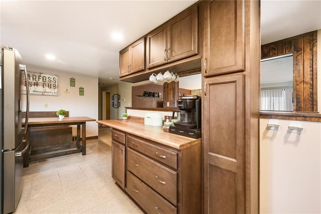 10 Bellview Drive McKees Rocks, PA 15136 - Photo 12 of 25 a kitchen with stainless steel appliances a sink and cabinets