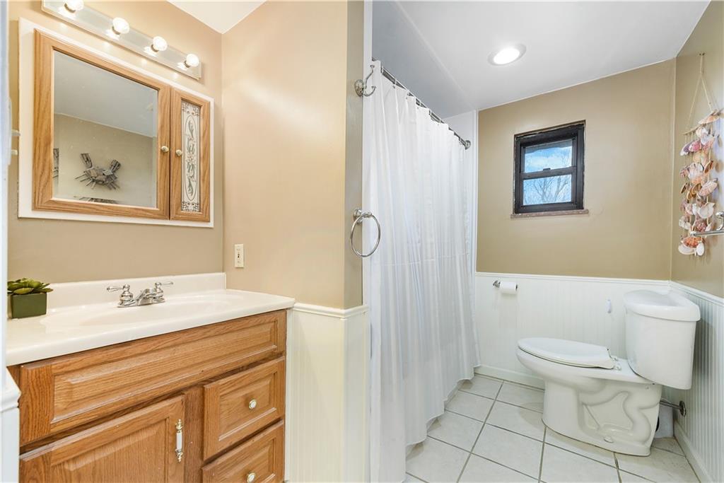 10 Bellview Drive McKees Rocks, PA 15136 - Photo 16 of 25 a bathroom with a sink mirror vanity and toilet