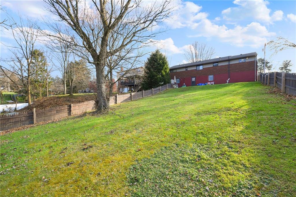 10 Bellview Drive McKees Rocks, PA 15136 - Photo 25 of 25 a front view of house with yard and trees in the background