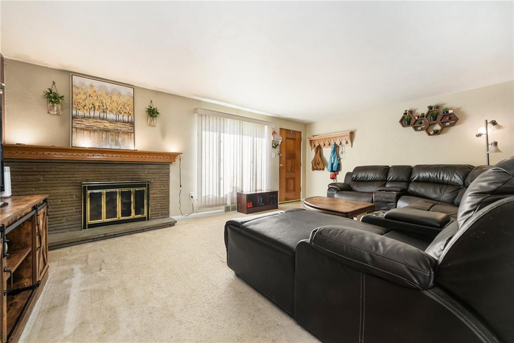 10 Bellview Drive McKees Rocks, PA 15136 - Photo 3 of 25 a living room with furniture and a fireplace