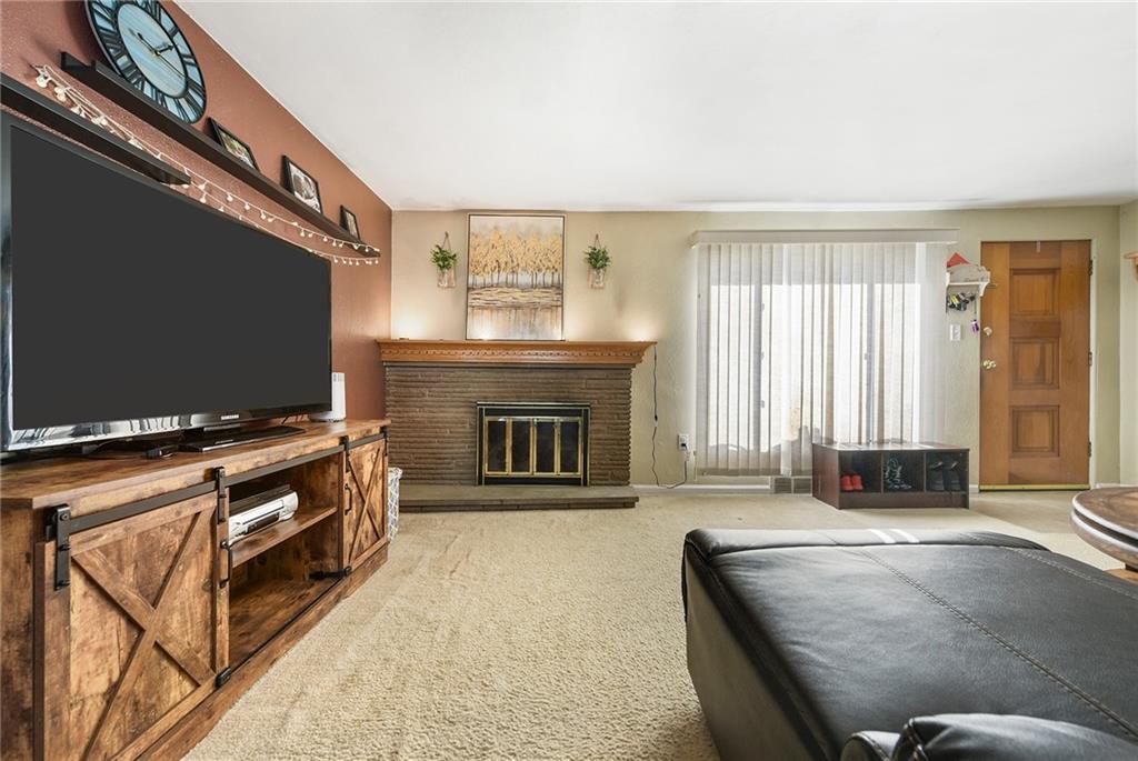 10 Bellview Drive McKees Rocks, PA 15136 - Photo 4 of 25 a living room with a flat screen tv and a fireplace