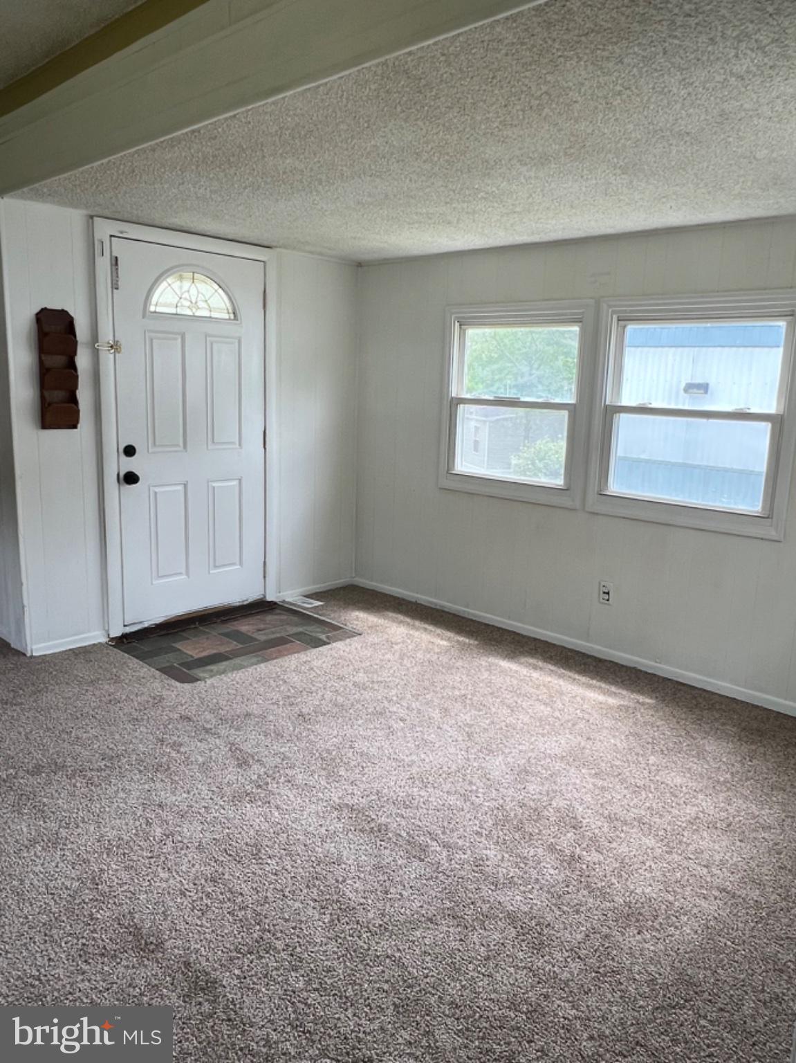 1302 Gibson Road, Unit 152 Bensalem, PA 19020 - Photo 5 of 18 an empty room with windows