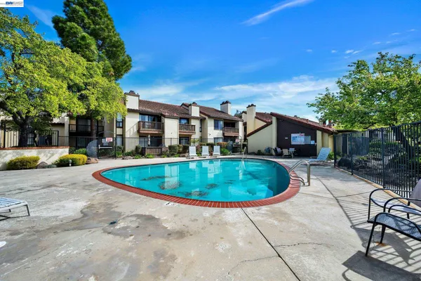 a view of a swimming pool with a patio