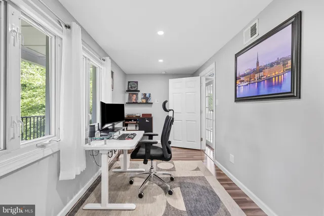 a workspace with furniture and window