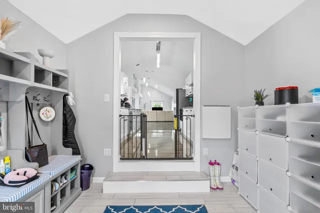 a view of an entryway with wooden floor