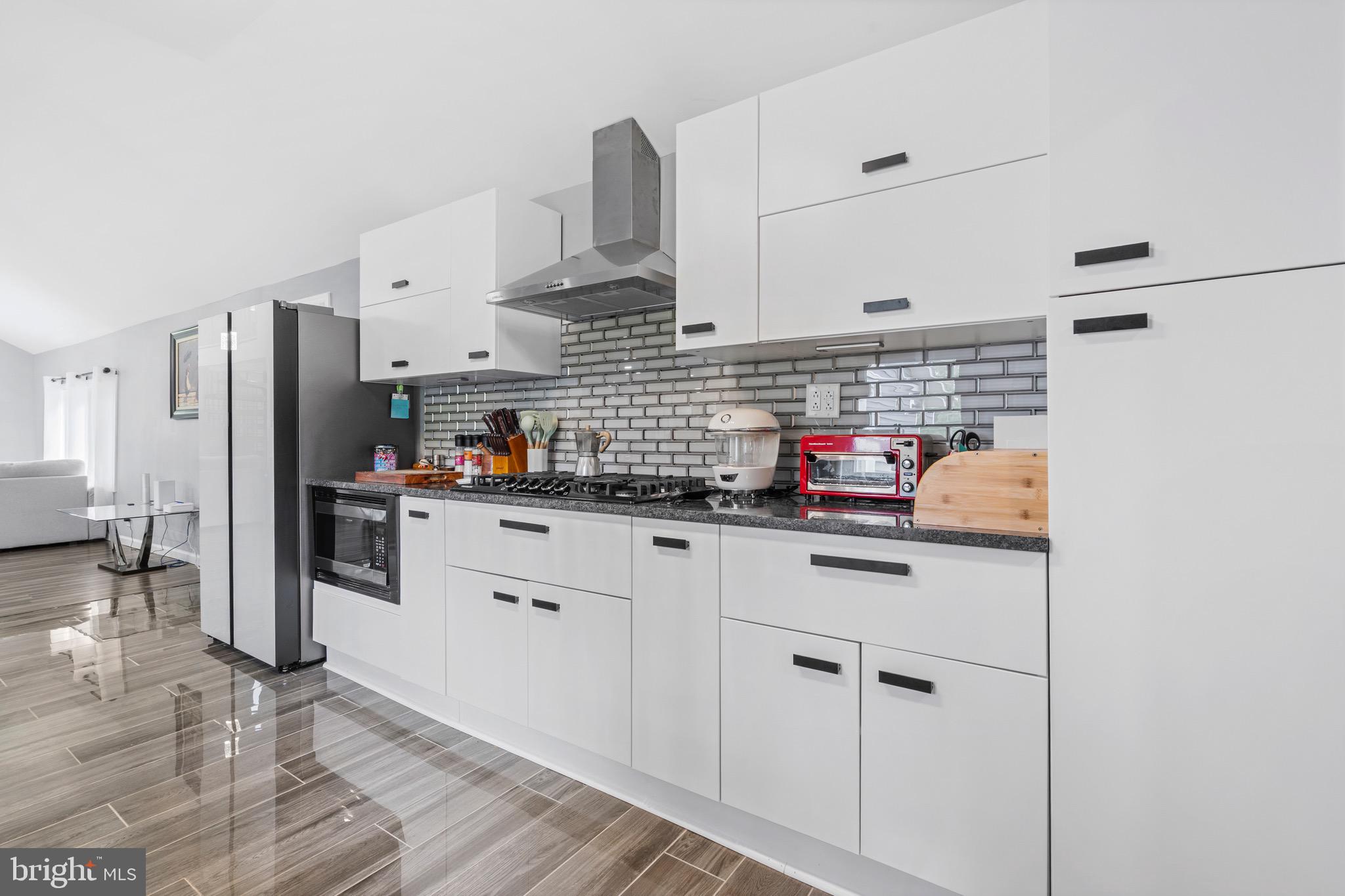 6 Kates Tract Mount Holly, NJ 08060 - Photo 10 of 36 a kitchen with stainless steel appliances a refrigerator sink and cabinets