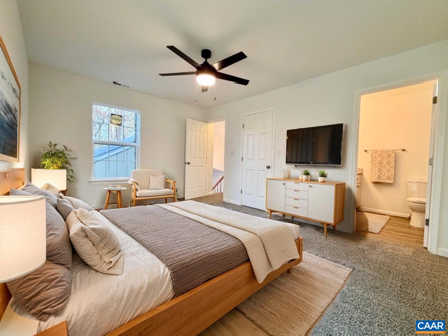 93 West Cedar Drive Ruckersville, VA 22968 - Photo 12 of 29 a bedroom with a bed and a flat screen tv