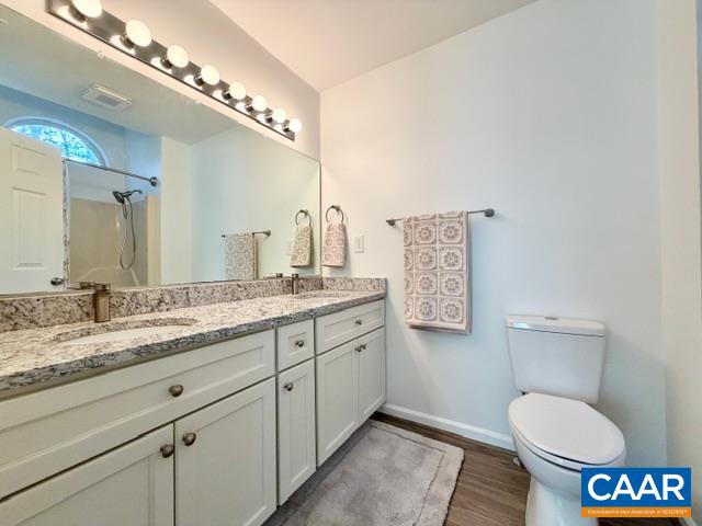 93 West Cedar Drive Ruckersville, VA 22968 - Photo 13 of 29 a bathroom with a granite countertop toilet sink and mirror