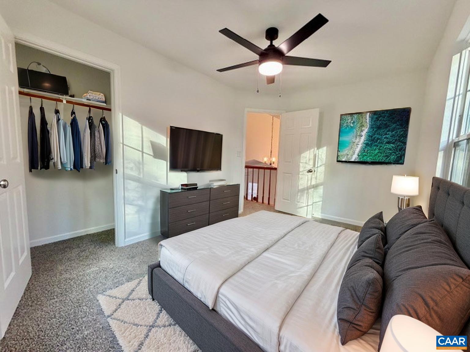 93 West Cedar Drive Ruckersville, VA 22968 - Photo 14 of 29 a bedroom with a bed and a flat screen tv