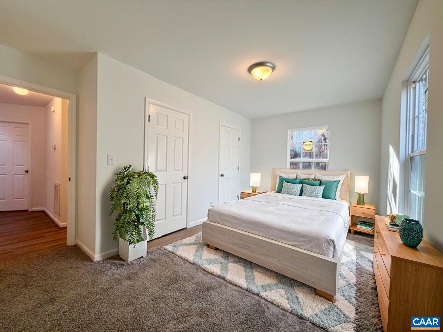 93 West Cedar Drive Ruckersville, VA 22968 - Photo 8 of 29 a bedroom with a bed and a potted plant