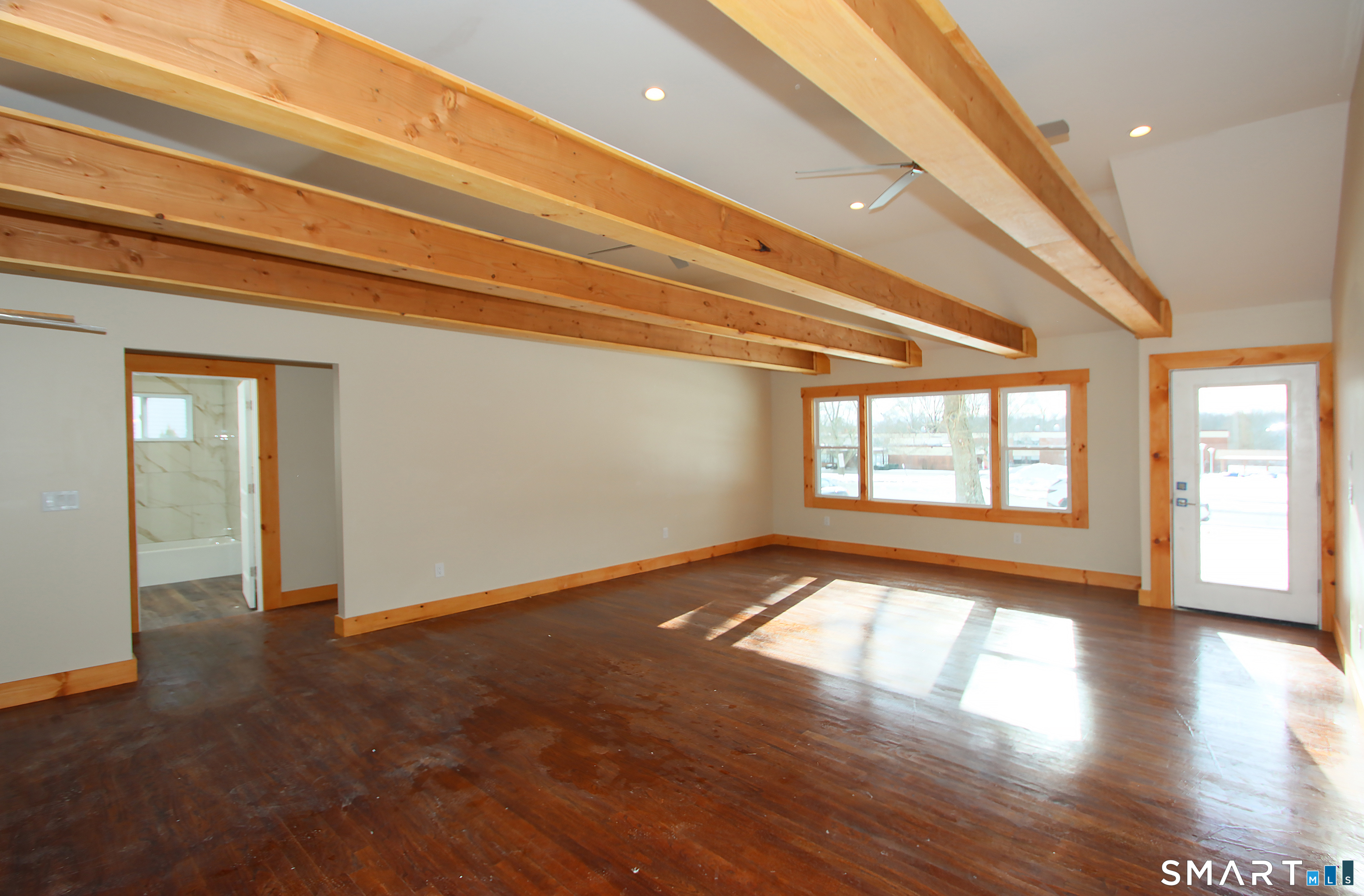 93 Overlook Road Meriden, CT 06450 - Photo 11 of 33 a view of an empty room with wooden floor and a window