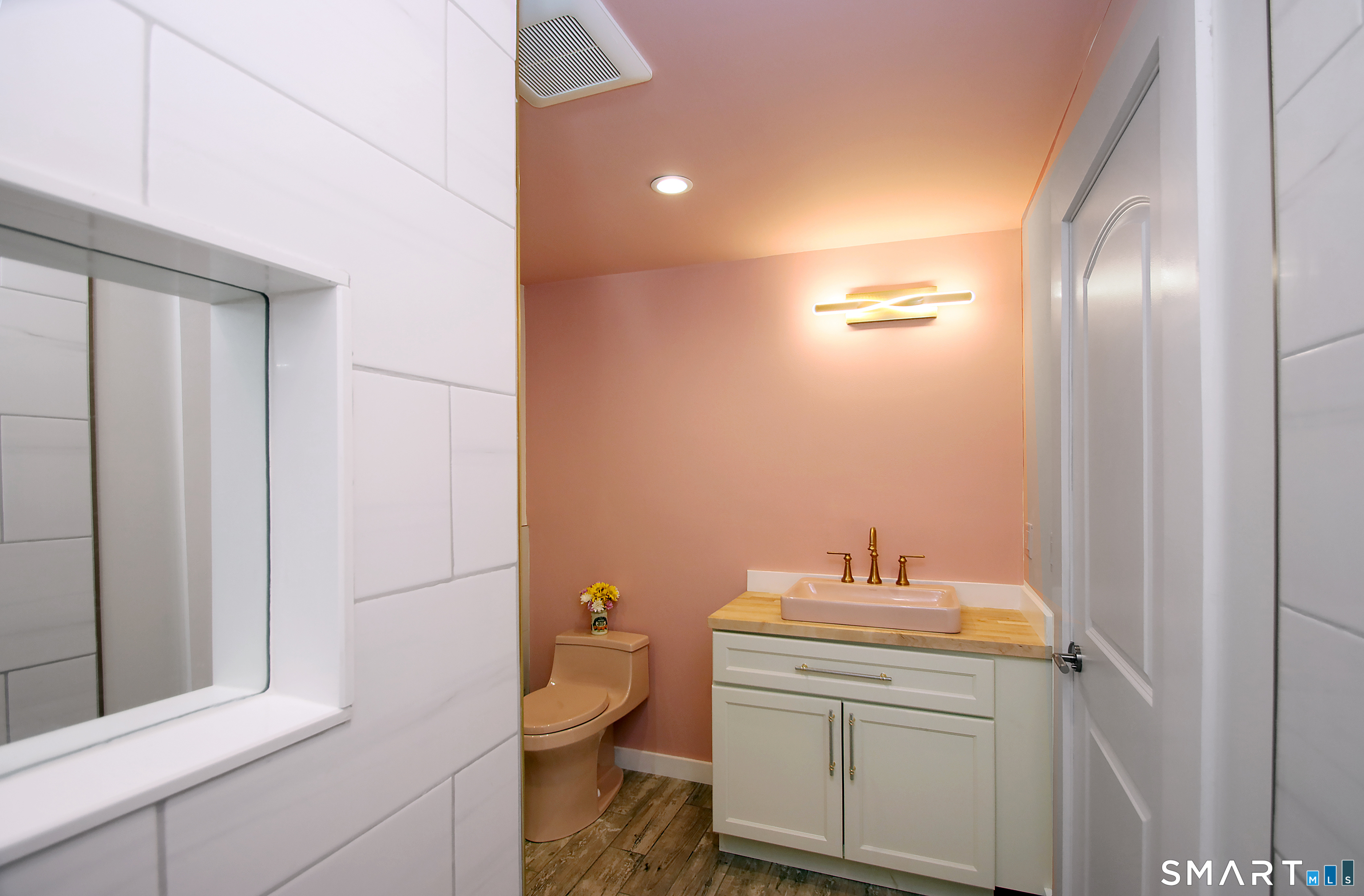 93 Overlook Road Meriden, CT 06450 - Photo 11 of 33 a bathroom with a toilet a sink and mirror