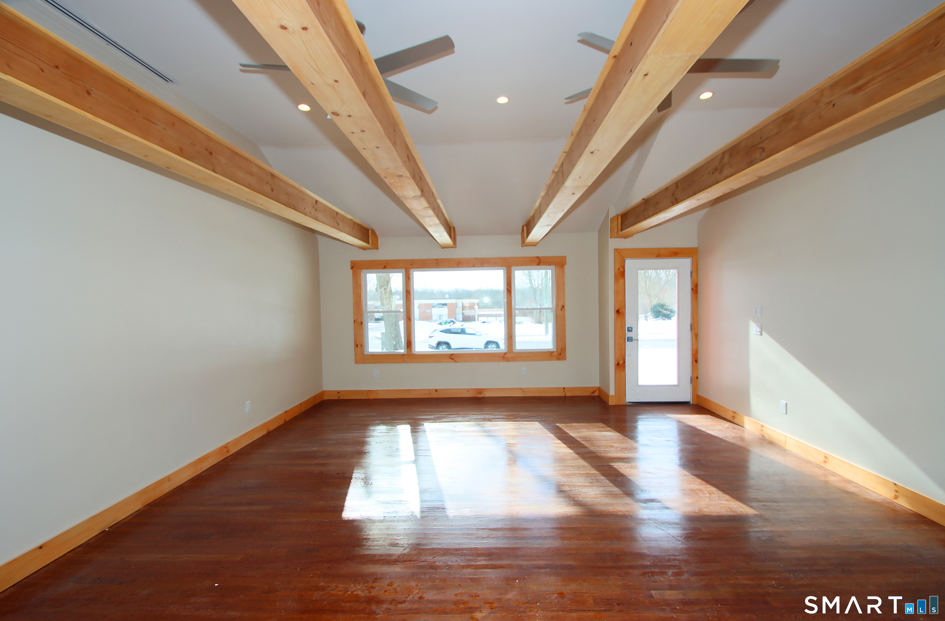 93 Overlook Road Meriden, CT 06450 - Photo 15 of 33 a view of empty room with wooden floor and fan