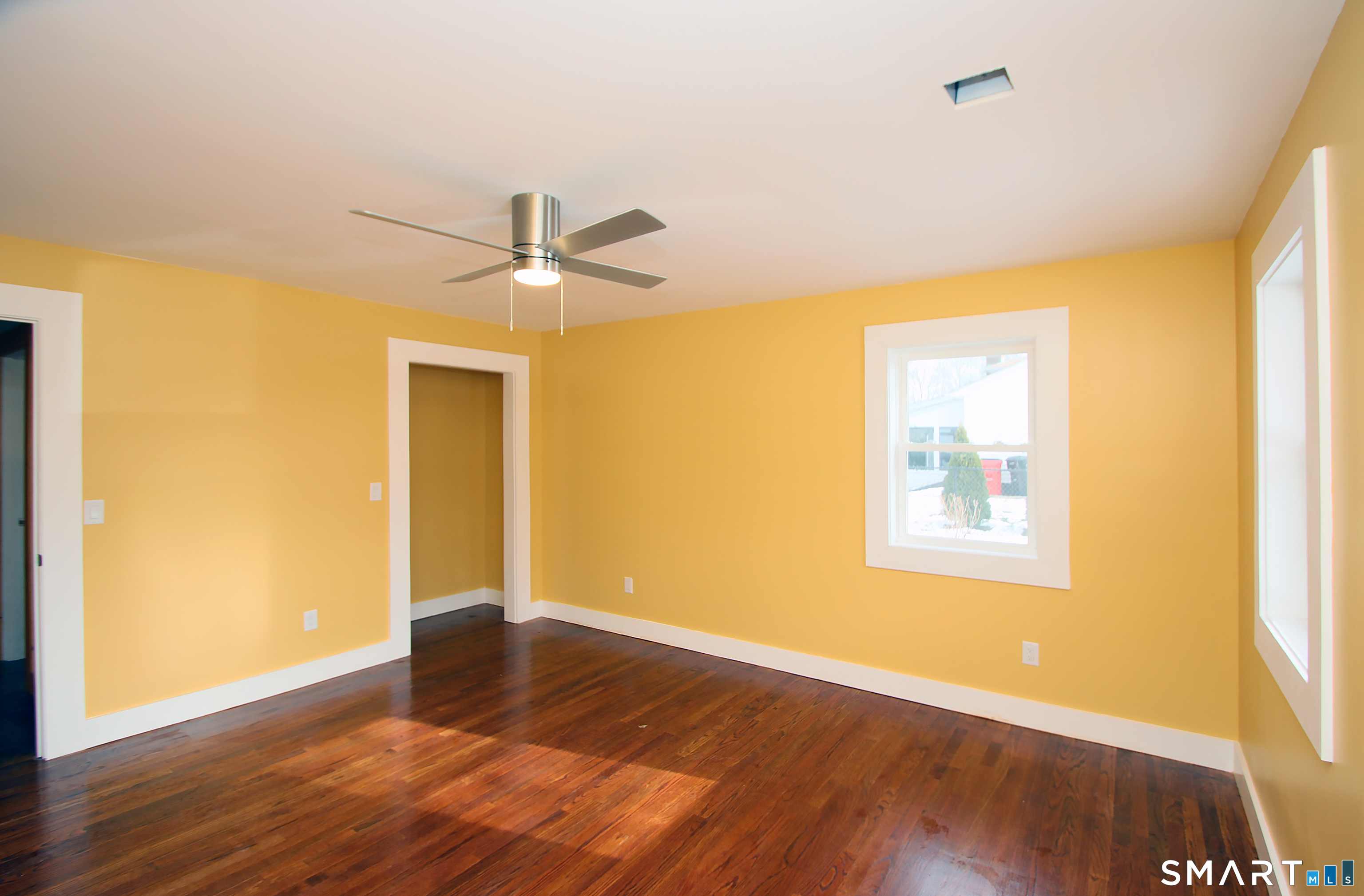 93 Overlook Road Meriden, CT 06450 - Photo 17 of 33 a view of an empty room with wooden floor and a window
