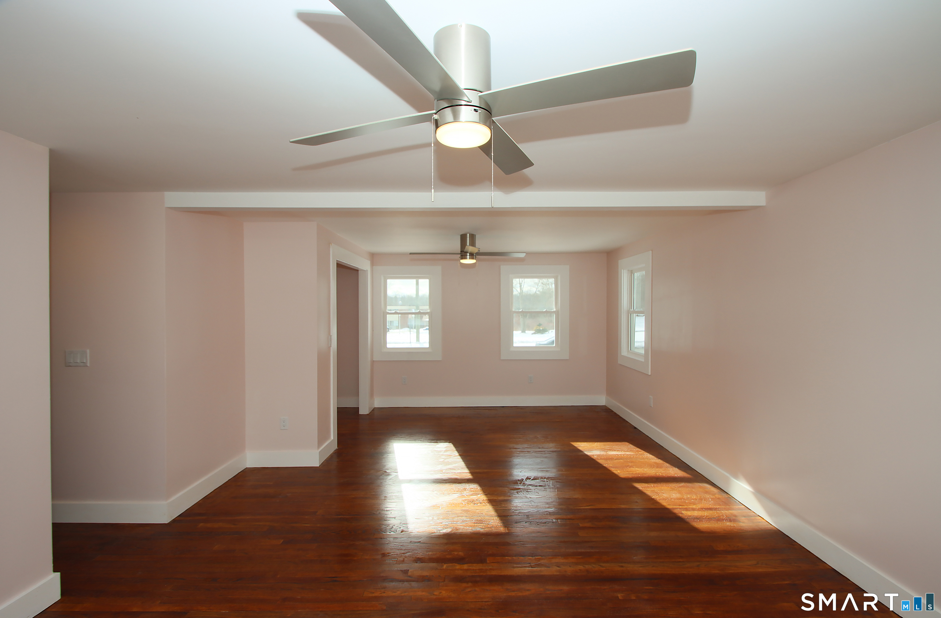 93 Overlook Road Meriden, CT 06450 - Photo 17 of 33 a view of empty room with wooden floor and fan