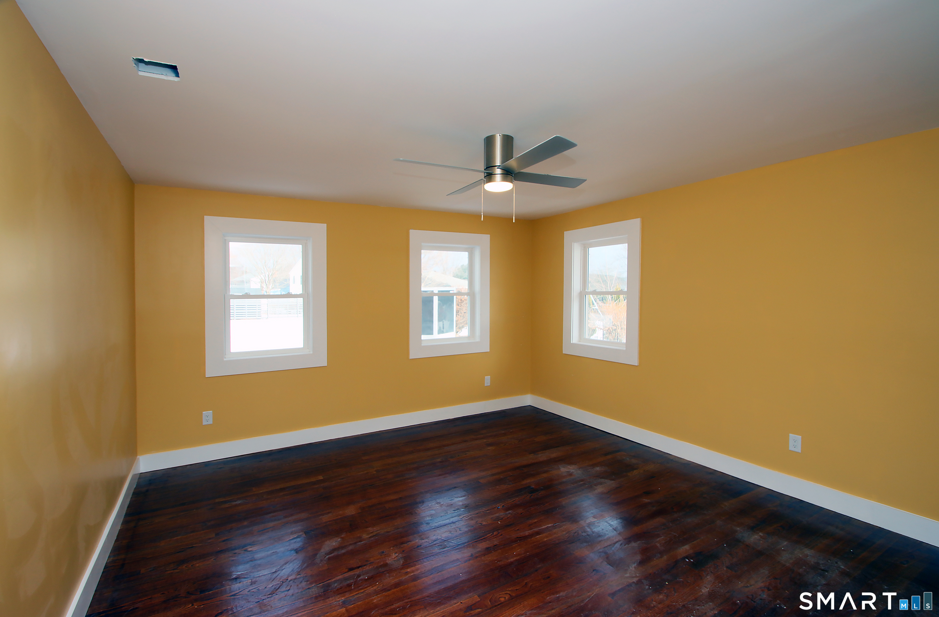93 Overlook Road Meriden, CT 06450 - Photo 21 of 33 a view of an empty room with wooden floor and a window