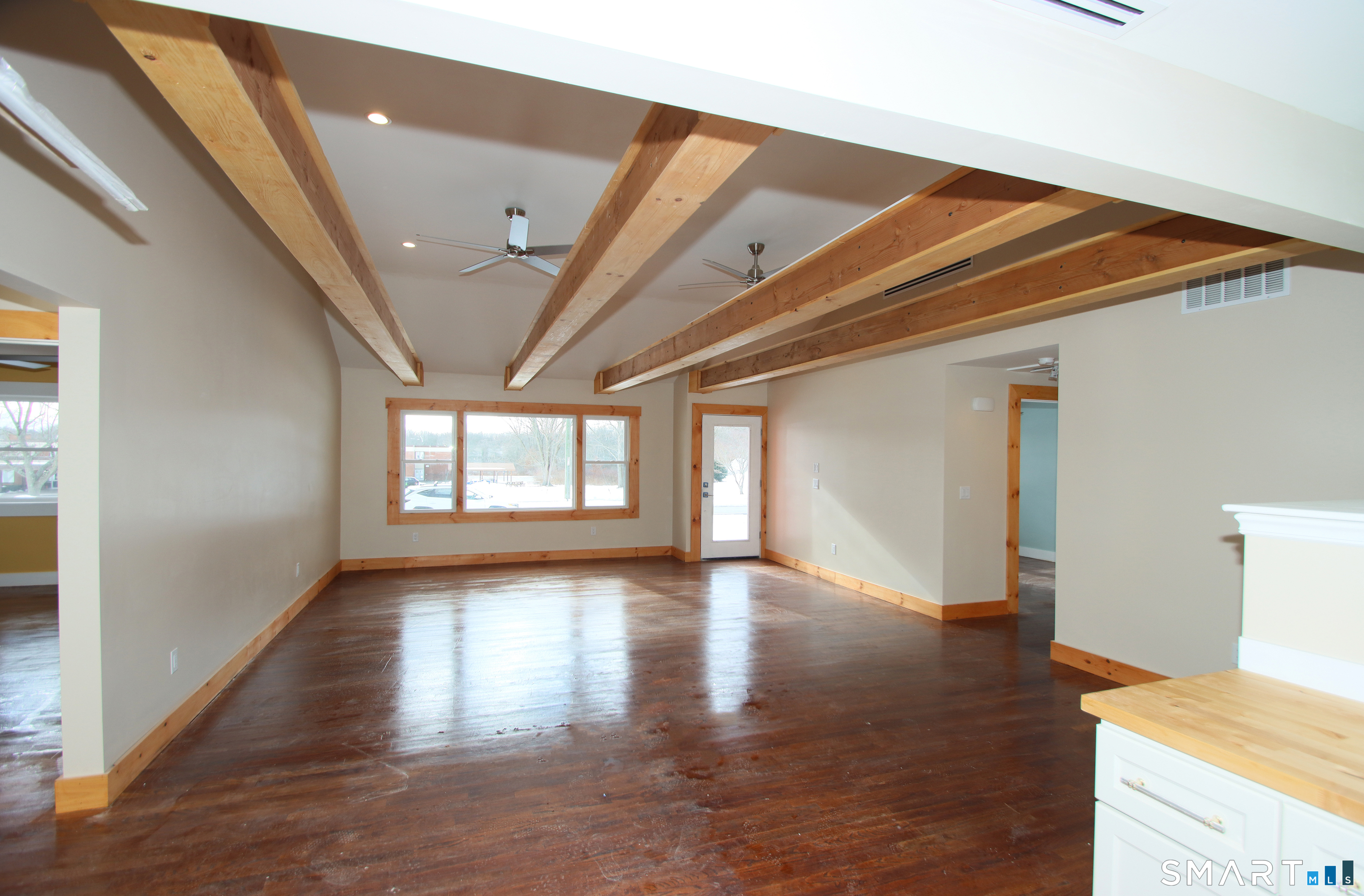93 Overlook Road Meriden, CT 06450 - Photo 22 of 33 a view of an empty room with window and wooden floor