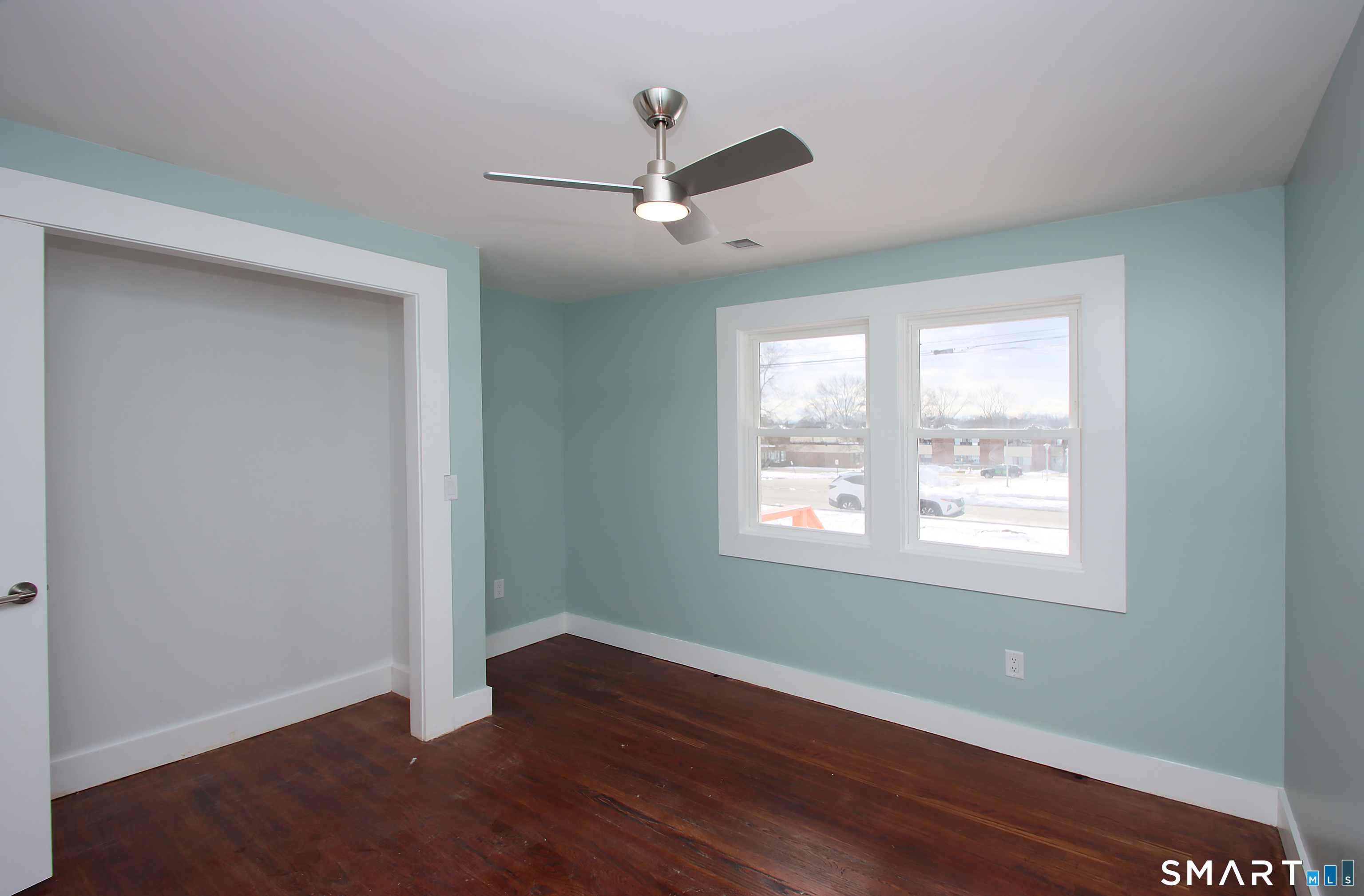 93 Overlook Road Meriden, CT 06450 - Photo 23 of 33 a view of an empty room with wooden floor and a window