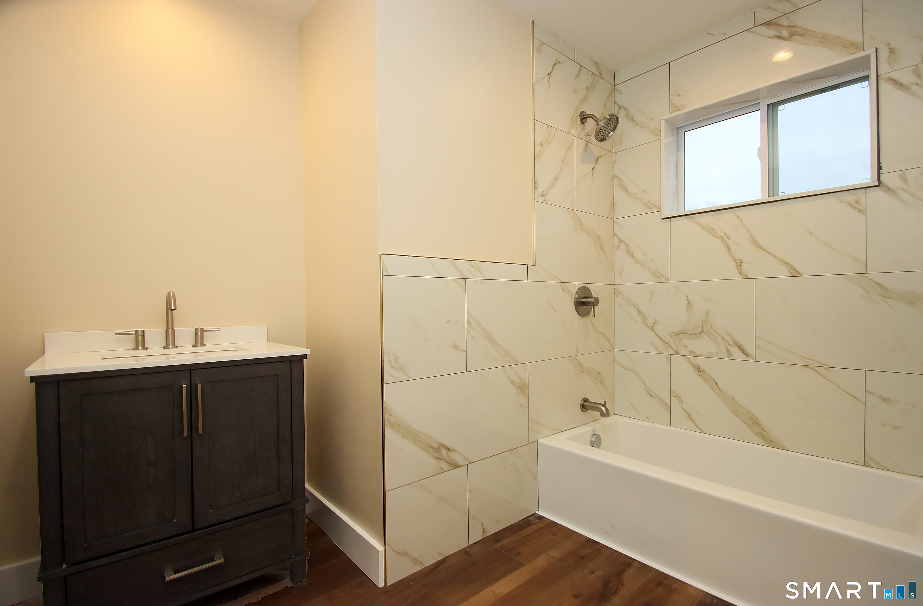 93 Overlook Road Meriden, CT 06450 - Photo 25 of 33 a bathroom with a bathtub a sink a vanity and a shower