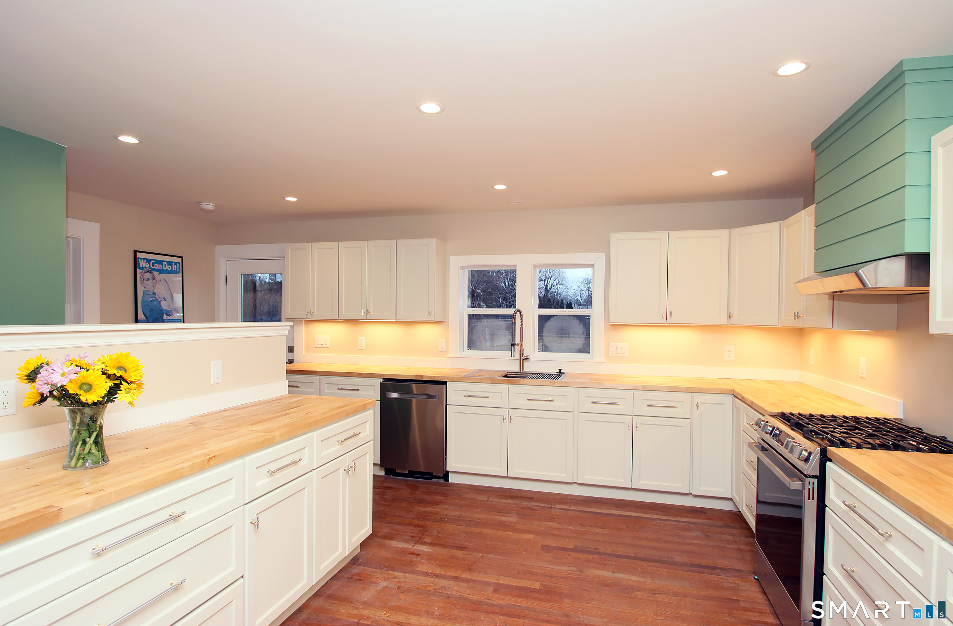 93 Overlook Road Meriden, CT 06450 - Photo 3 of 33 a large kitchen with stainless steel appliances lots of counter space and wooden floor