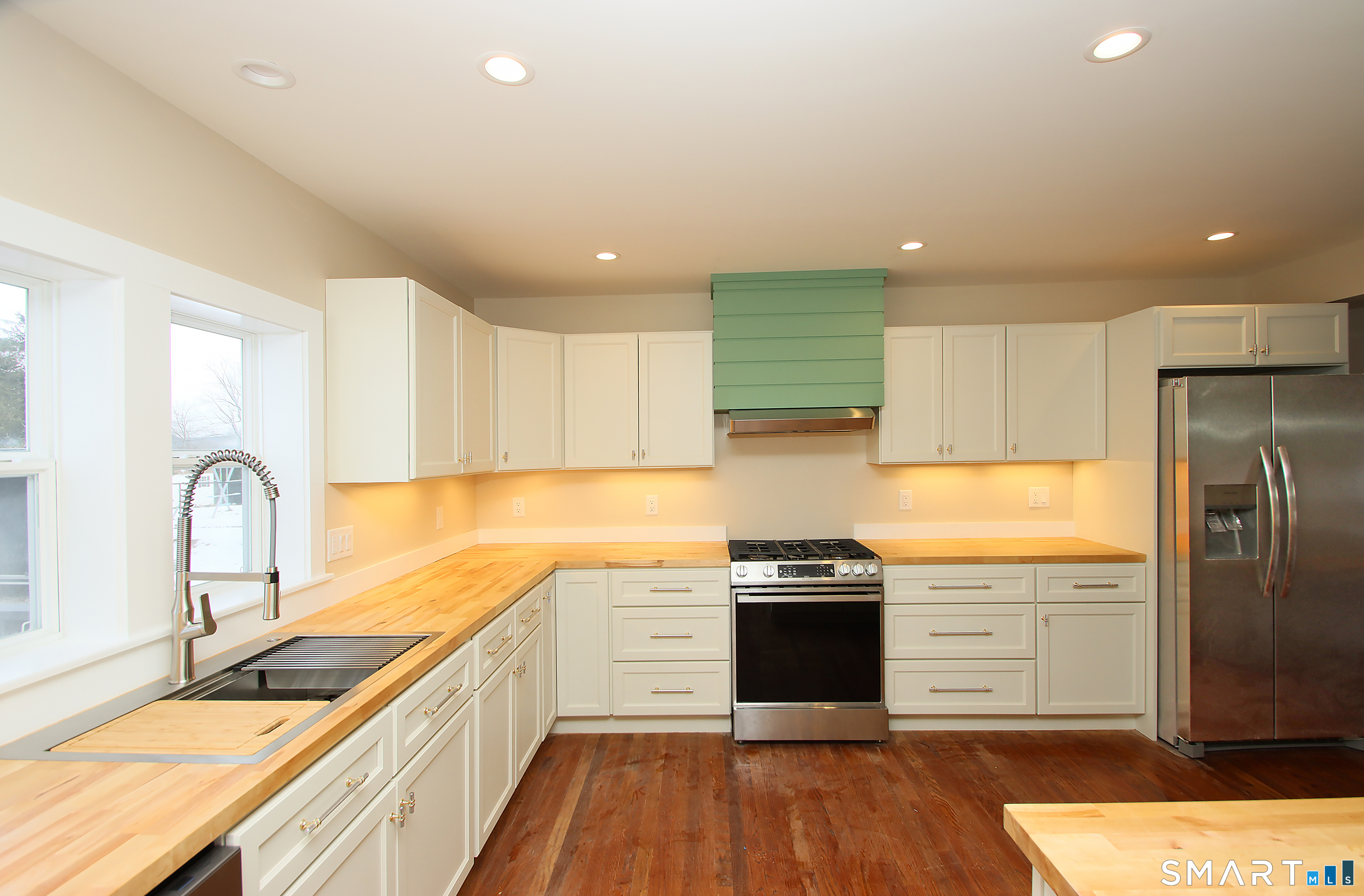 93 Overlook Road Meriden, CT 06450 - Photo 8 of 33 a kitchen with stainless steel appliances granite countertop a sink stove and refrigerator