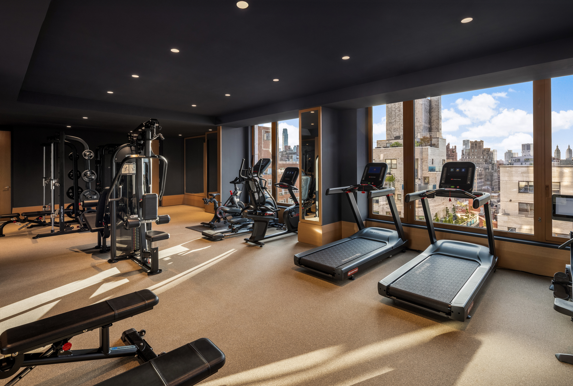 201 East 74th Street, Unit 30 Manhattan, NY 10021 - Photo 22 of 28 a view of a gym with gym equipment