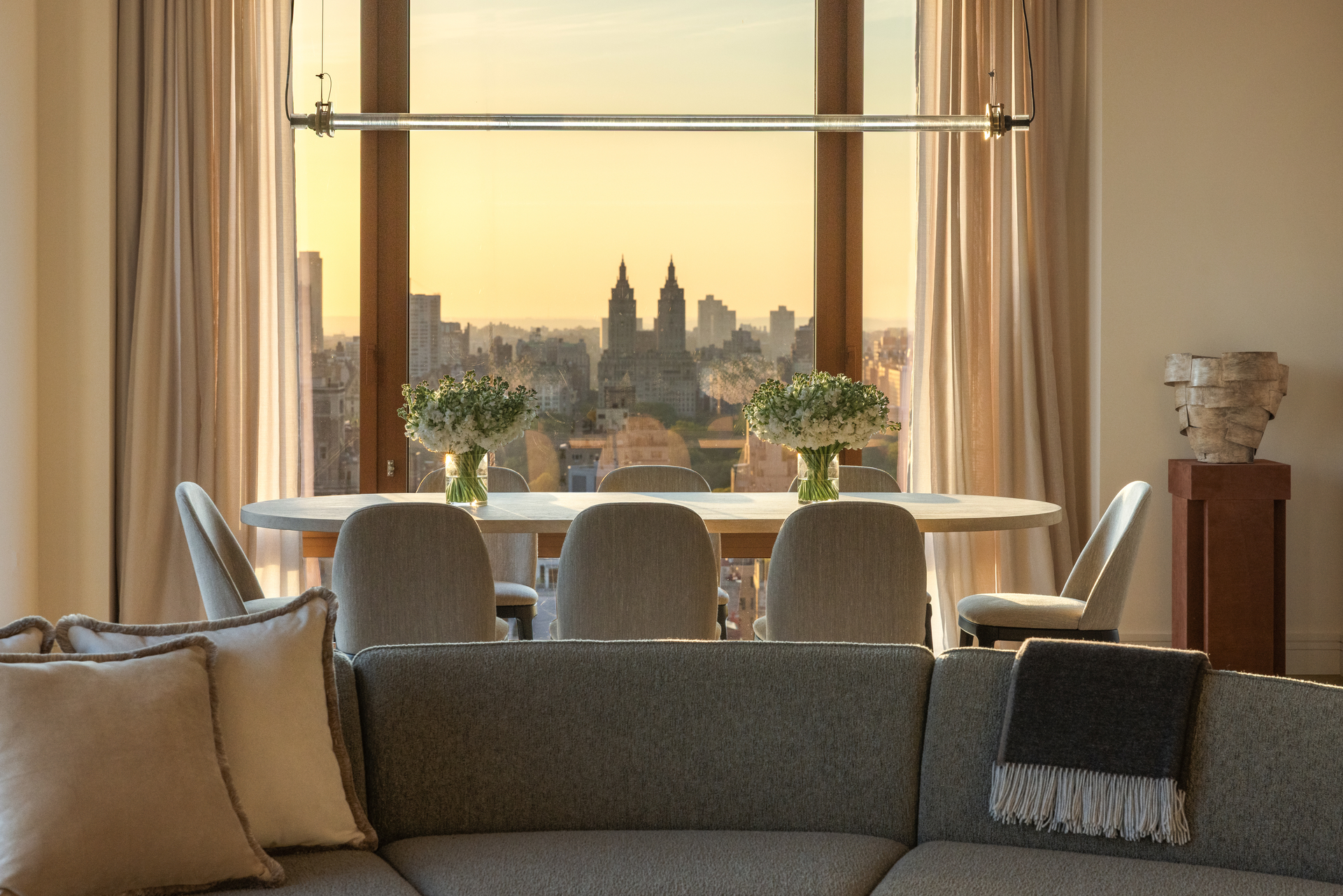 201 East 74th Street, Unit 30 Manhattan, NY 10021 - Photo 4 of 28 a living room with couches a coffee table and a floor to ceiling window