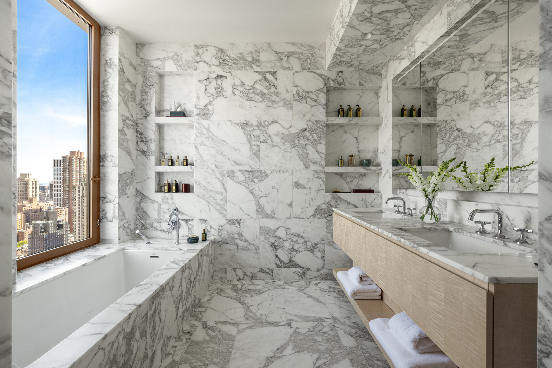 201 East 74th Street, Unit 30 Manhattan, NY 10021 - Photo 7 of 28 a bathroom with a bathtub and a sink