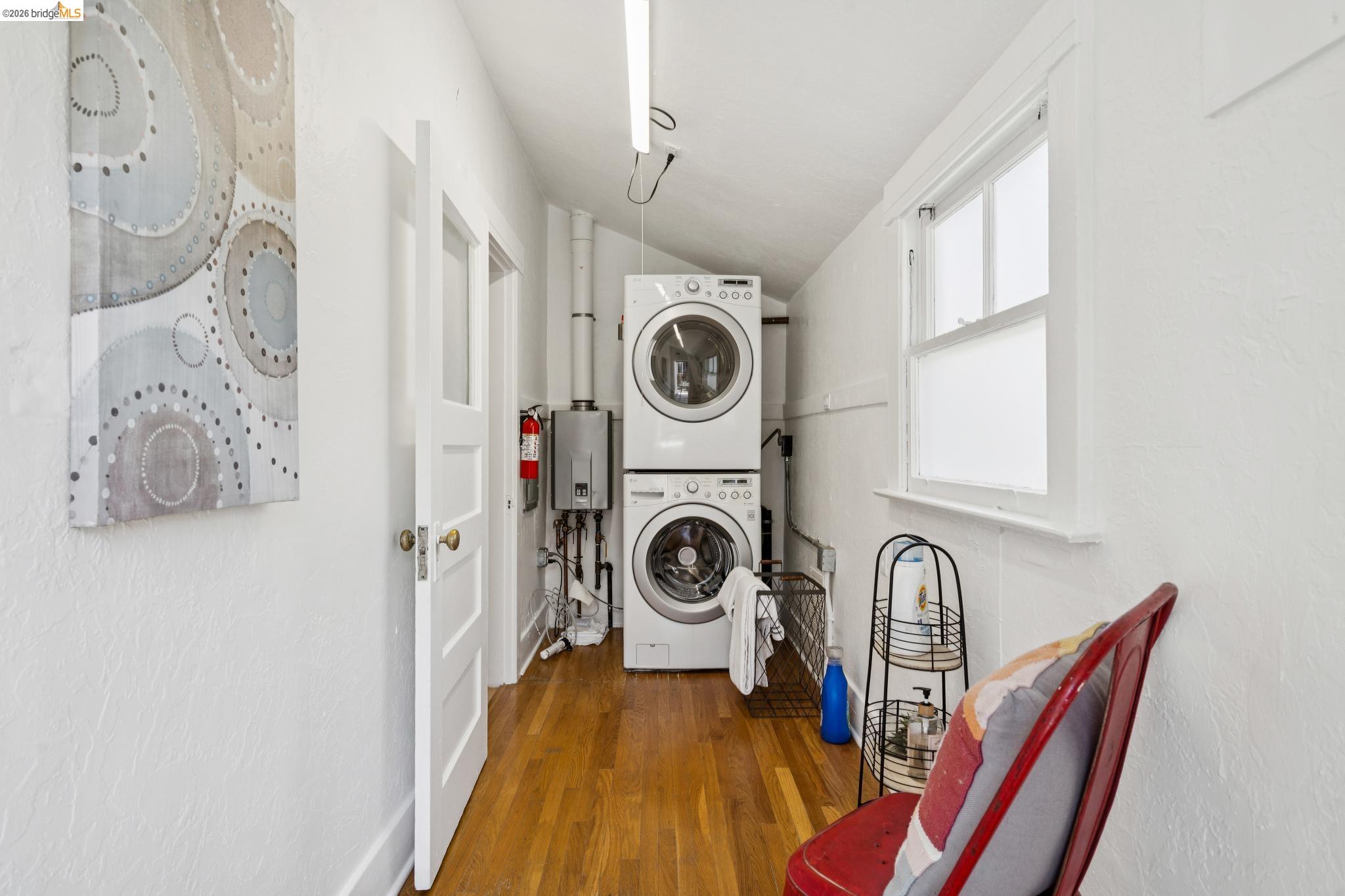 1701 Derby Street Berkeley, CA 94703 - Photo 31 of 39 Dedicated laundry area featuring stacked front-load washer and dryer units