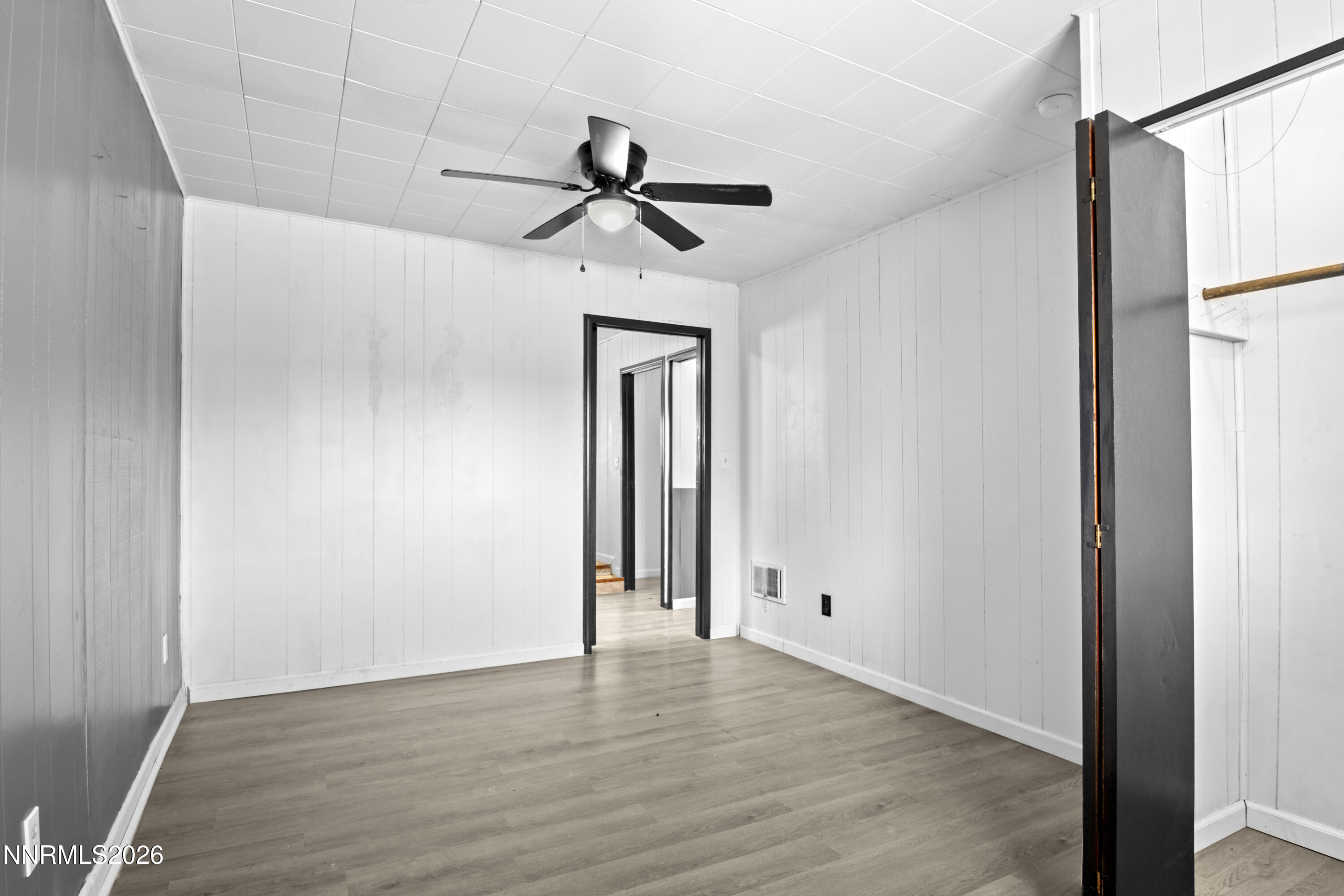 885 I Street Hawthorne, NV 89415 - Photo 14 of 20 a view of empty room with wooden floor and fan