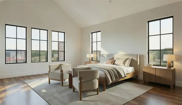 a bedroom with a bed and a large window