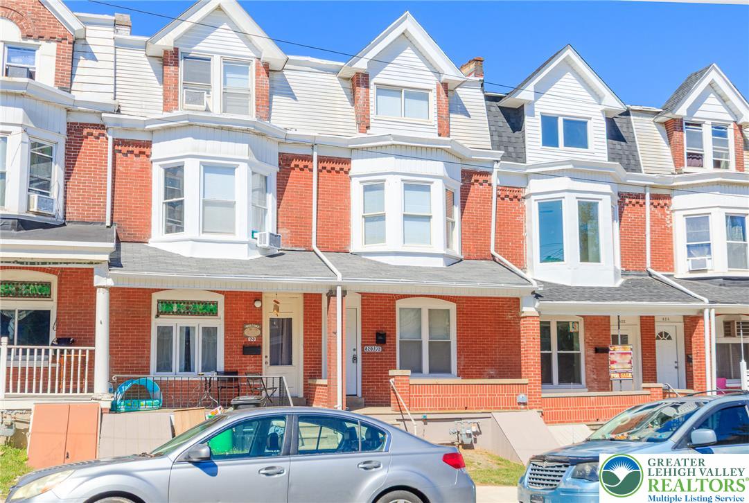 820 North 5th Street Allentown, PA 18102 - Photo 7 of 39 Brick facade townhome with bay windows and prominent dormers presents classic charm.