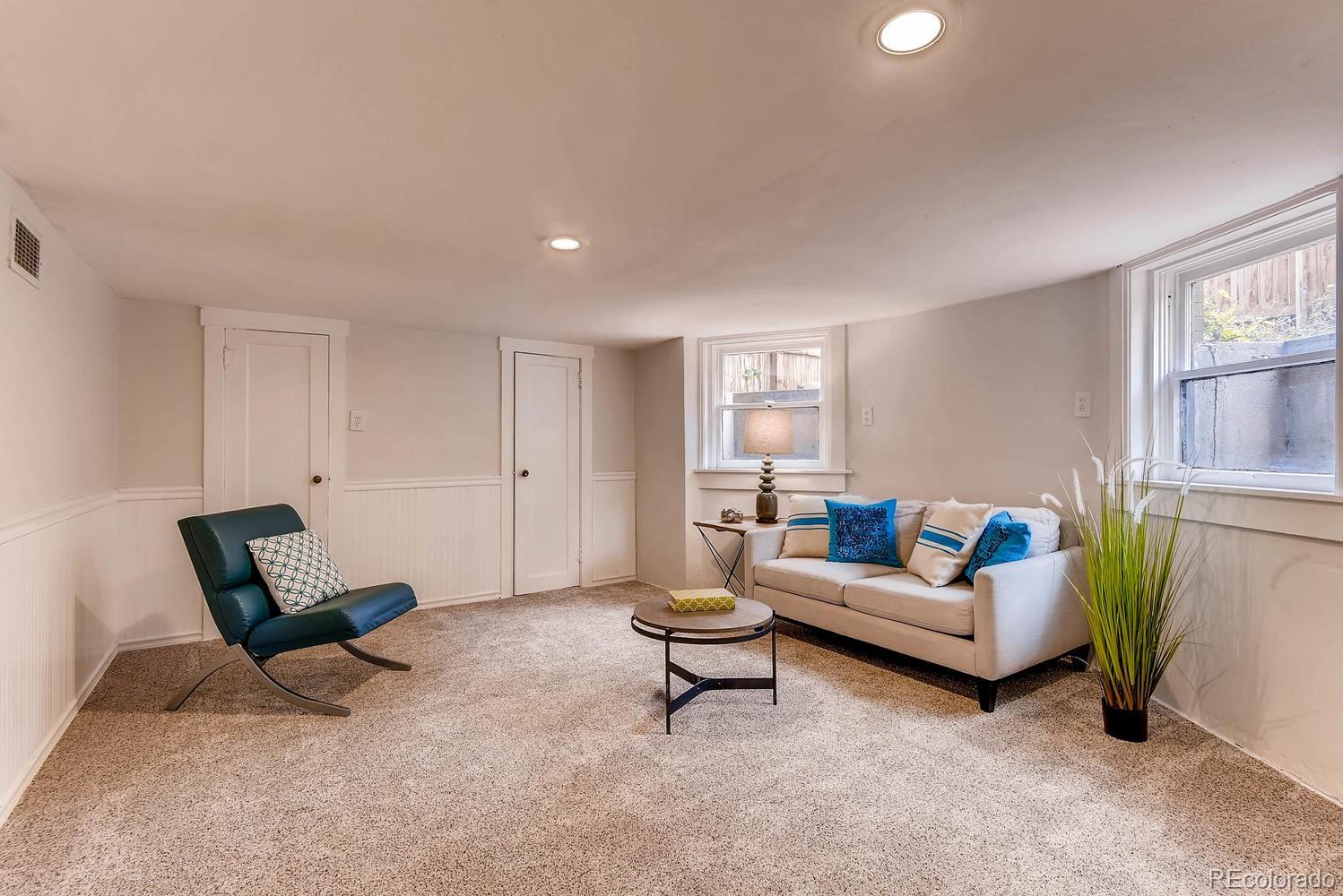 2030 Park Place Denver, CO 80205 - Photo 22 of 28 a living room with furniture and a window