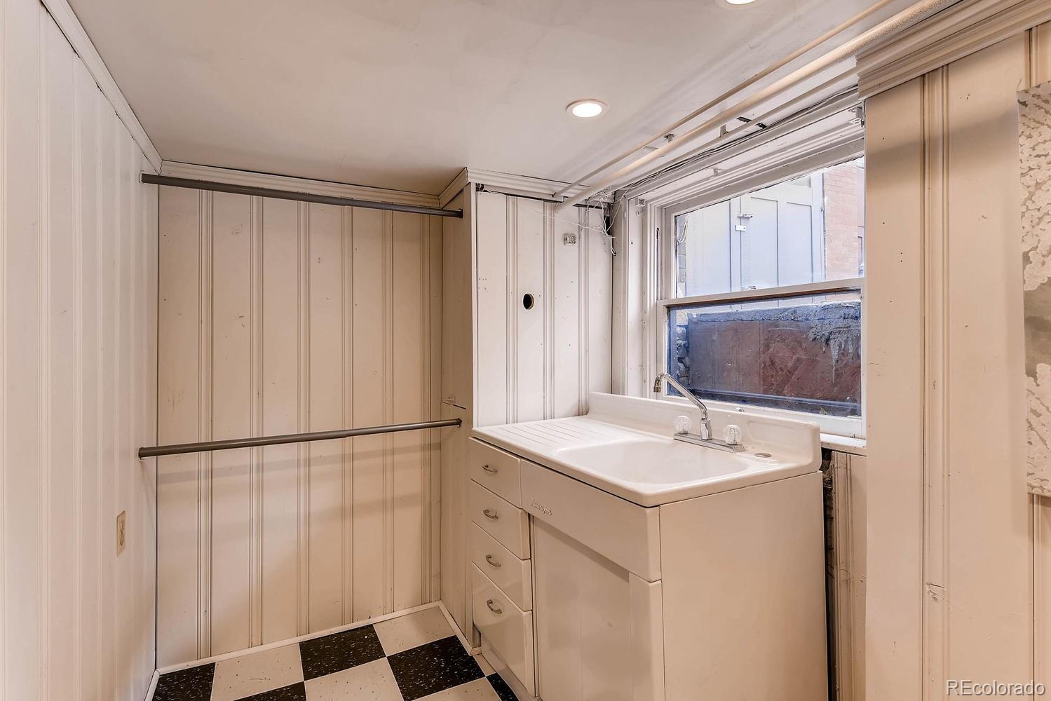 2030 Park Place Denver, CO 80205 - Photo 24 of 28 a bathroom with a sink and a mirror