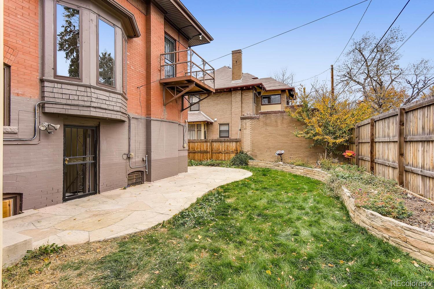 2030 Park Place Denver, CO 80205 - Photo 26 of 28 a view of a house with a yard