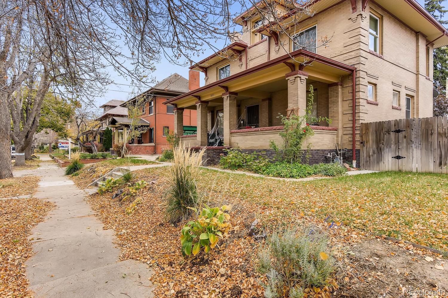2030 Park Place Denver, CO 80205 - Photo 28 of 28 a front view of a house with a yard