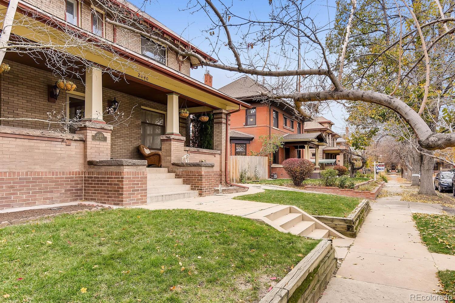 2030 Park Place Denver, CO 80205 - Photo 3 of 28 a view of a house with a yard