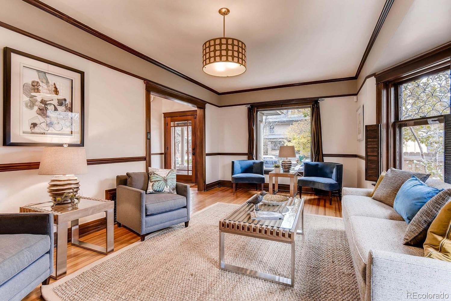 2030 Park Place Denver, CO 80205 - Photo 6 of 28 a living room with furniture a rug and a large window