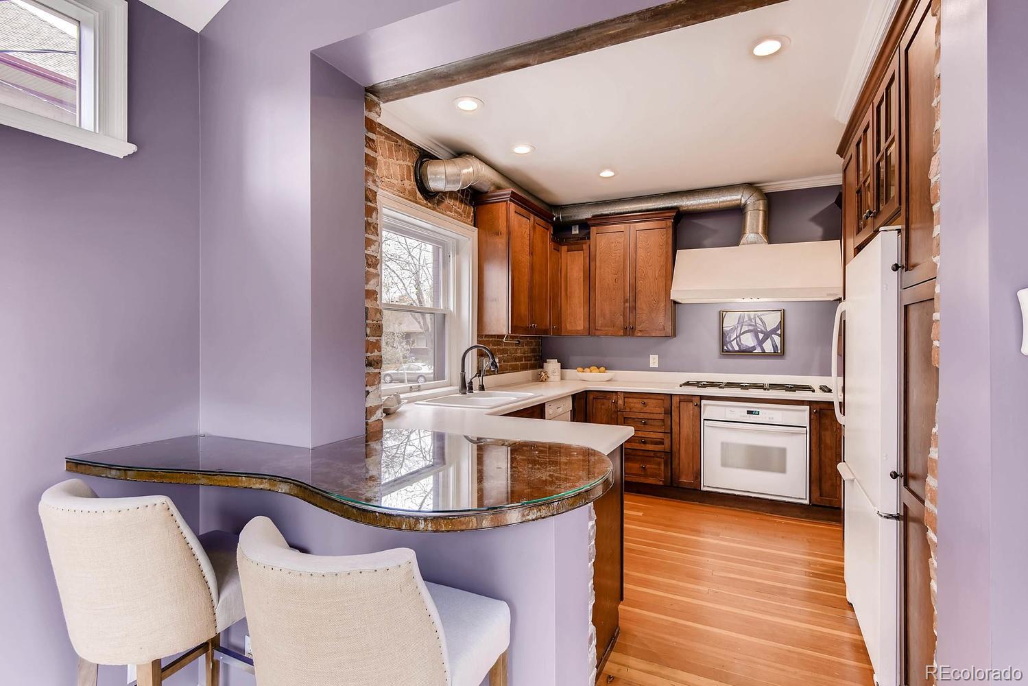 2030 Park Place Denver, CO 80205 - Photo 8 of 28 a kitchen with a sink cabinets and appliances