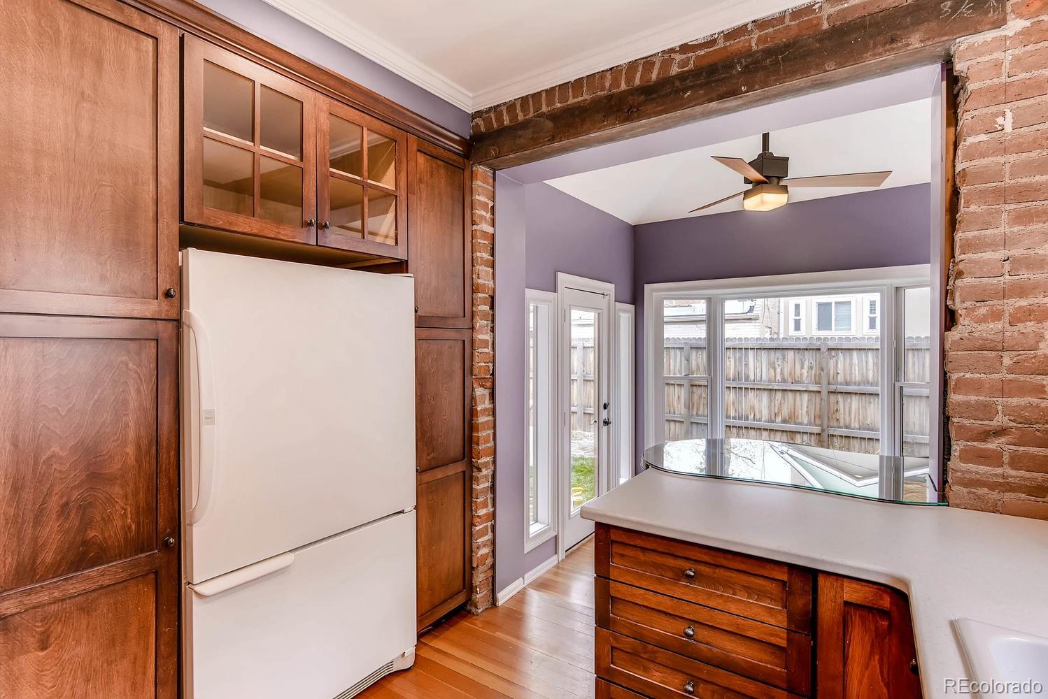 2030 Park Place Denver, CO 80205 - Photo 10 of 28 a hallway with a large window and a refrigerator
