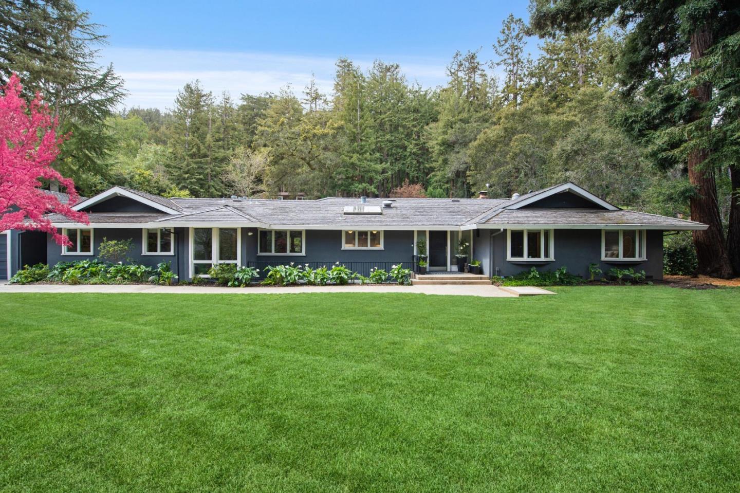 3600 Tripp Road Woodside, CA 94062 - Photo 2 of 2 a front view of a house with a garden