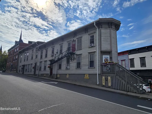 a front view of a house with garage