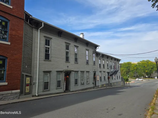 a view of a house with a street